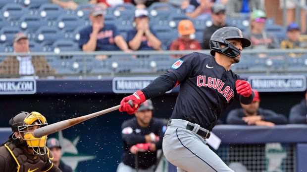 Feb 26, 2024; Peoria, Arizona, USA; Cleveland Guardians second baseman Andres Gimenez (0) grounds out in the first inning against the San Diego Padres during a spring training game at Peoria Sports Complex.